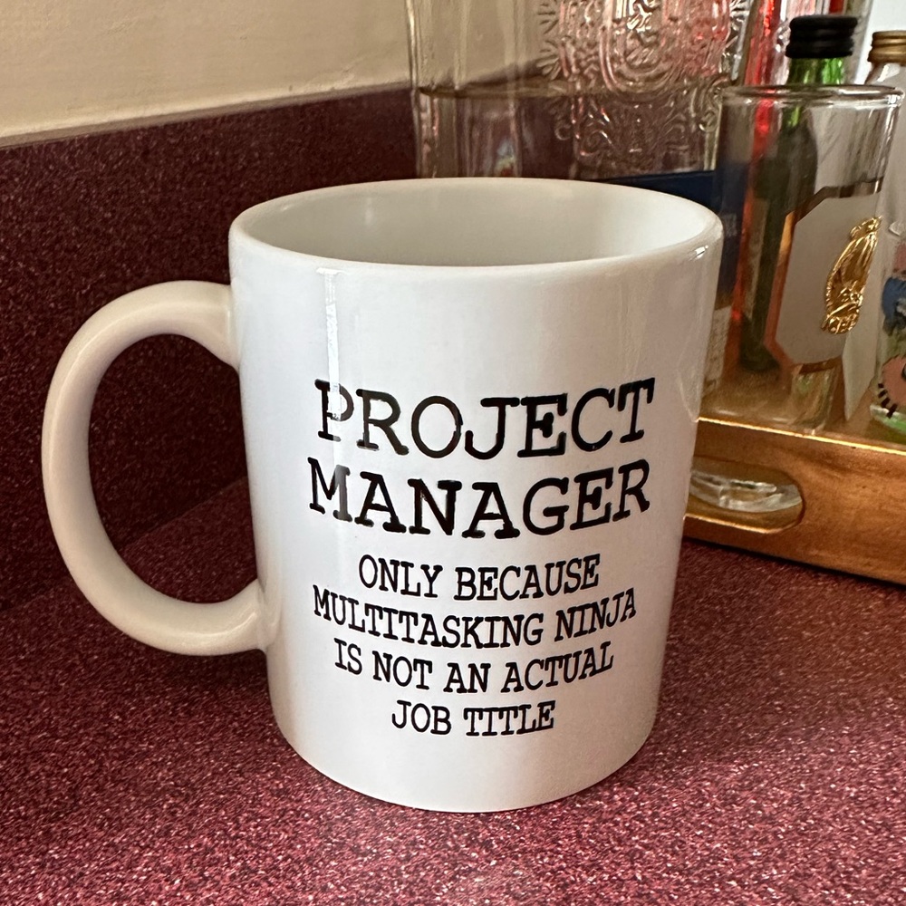 White with black font project manager mug
